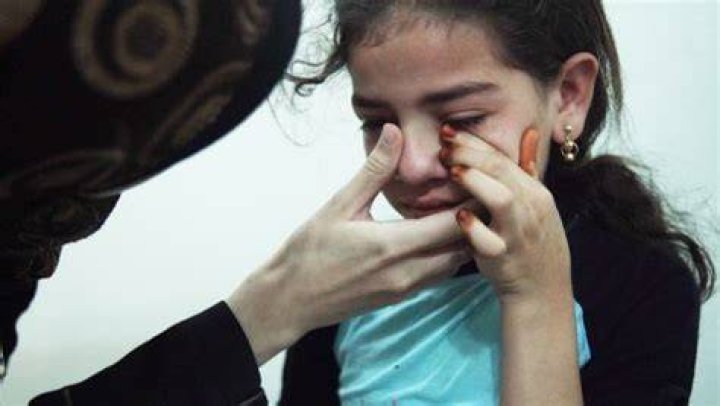 Dr. Amani comforts a young girl